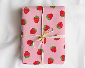 May include: A wrapped gift with pink wrapping paper featuring a pattern of red strawberries with green leaves. The gift is tied with a cream-colored ribbon. The text "Horde Mentality" is in the upper right corner.