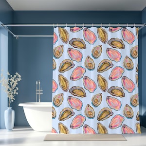 May include: A light blue shower curtain featuring a repeating pattern of watercolor oyster illustrations. The oysters are depicted in shades of pink, gold, and gray, creating a coastal theme. The curtain is hanging in a bathroom setting.