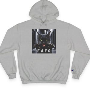 May include: A gray hooded sweatshirt with a black cat graphic and the text "FAFO" printed on the front.