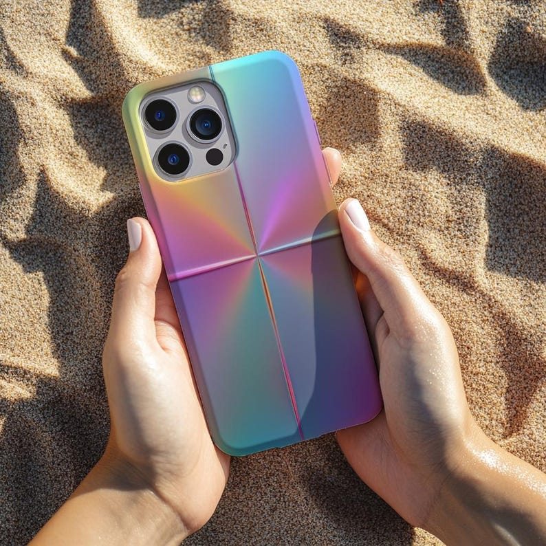 May include: A multi-colored phone case with a gradient design, transitioning from yellow to purple and blue. The case has a cross-like pattern in the center and a camera cutout. The phone case is held in two hands.