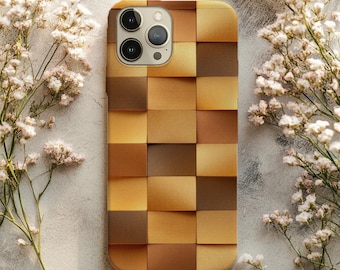 May include: A phone case with a geometric design of varying shades of brown and gold. The case has a square pattern, with each square slightly raised. The phone case has a camera cutout and is surrounded by white flowers.