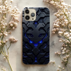 May include: Black phone case with a geometric pattern and blue neon highlights. The case has a textured surface and a futuristic design. The phone case is surrounded by white flowers.