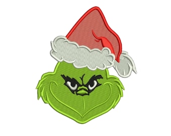 Op de afbeelding: Geborduurd ontwerp van een groen gezicht met een ondeugende uitdrukking, met een rode kerstmuts met witte rand. Het ontwerp heeft zwarte ogen en een gestikte omtrek, perfect voor kerstknutselen en kleding.