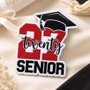 May include: A red and white embroidered patch with the text "22" and "twenty" in a script font, topped with a black graduation cap. The word "SENIOR" is displayed in bold, black letters below the numbers.