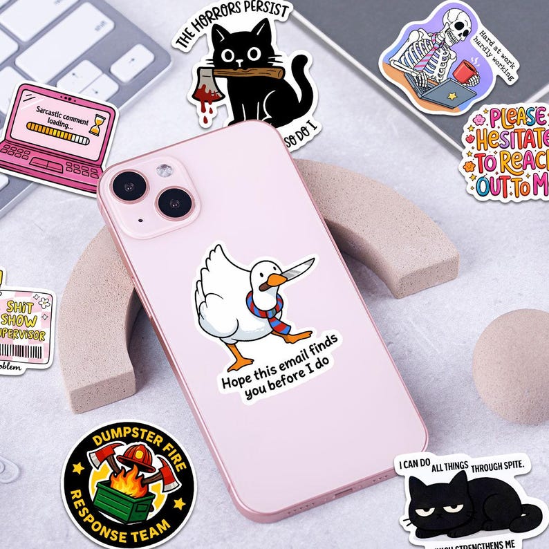 a collection of various stickers and illustrations, including a pink phone case with a cartoon duck holding a knife, a skeleton with a cup, and other whimsical and humorous designs.