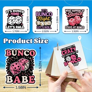 May include: A collection of Bunco-themed stickers and a small notepad. The stickers feature dice and phrases like "It's Bunco Time," "Bunco Night," and "What Happens at Bunco Stays at Bunco." The notepad has the text "If you think I'm crazy, you should see my Bunco group."
