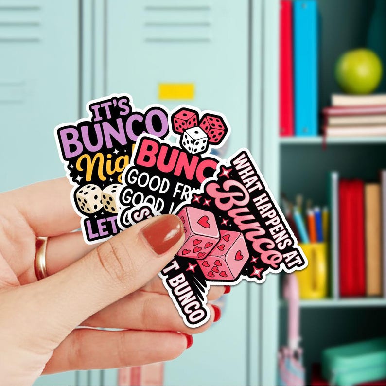 May include: A collection of colorful stickers with text and dice graphics. The stickers feature phrases like "It's Bunco Night" and "What Happens at Bunco". The dice are pink, white, and red.