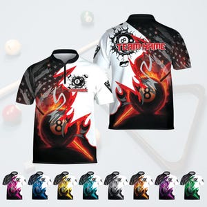 May include: Short-sleeved polo shirts with a black and white design featuring an 8-ball graphic engulfed in flames. The shirts have a zipper collar and a design that includes the American flag. The text "TEAM NAME" is visible.
