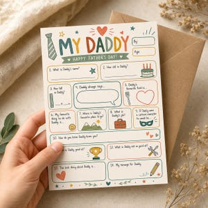 Puede incluir: Una tarjeta del Día del Padre con la frase "MY DADDY" en letras coloridas. La tarjeta tiene preguntas para completar sobre el nombre, la edad, las preferencias de papá y un mensaje. Un sobre marrón está en el fondo.