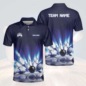 May include: Navy blue polo shirt with a bowling theme. The front features a bowling pin graphic and the text "YOUR NAME". The back of the shirt displays "TEAM NAME" in white text. The design includes bowling pins and a bowling ball.