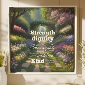 May include: A framed art print depicting a garden path with colourful flowers and trees. The artwork includes the text "Strength and dignity are her clothing. She laughs at the time to come. She opens her mouth with wisdom. Kind instruction is on her tongue." Proverbs 31:25-26.