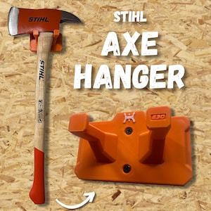 May include: An orange axe hanger with the text "STIHL AXE HANGER" in white. The hanger is designed to hold an axe with a wooden handle and a red and silver axe head. The axe is also branded with the "STIHL" logo.