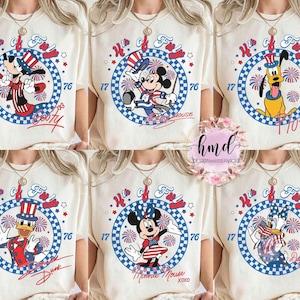 May include: Cream-coloured t-shirts featuring Disney characters in patriotic outfits. Each shirt has a circular design with fireworks, stars, and the text "H of Fun" and "76". Characters include Mickey, Minnie, Pluto, and Donald.