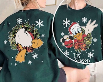 Bonita camiseta navideña del Pato Donald "Tis' The Season", camiseta "Muy Feliz Navidad 2025" de Mickey y sus amigos, regalo para viaje familiar a Disney Magic Kingdom.