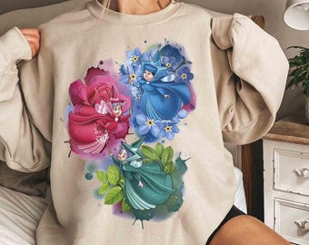 Camiseta unisex de Disney La Bella Durmiente, Hadas Buenas, Flora, Fauna y Merryweather, Magic Kingdom WDW Holiday, regalo de cumpleaños familiar para adultos.