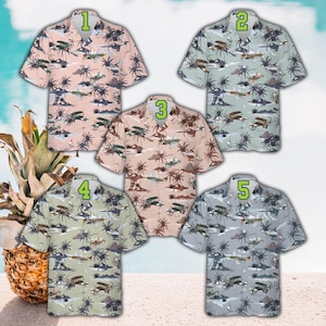 May include: Five short-sleeved button-down shirts with a tropical airplane and palm tree pattern. The shirts are in shades of pink, green, tan, and blue. Each shirt is numbered 1 through 5 in a green font.