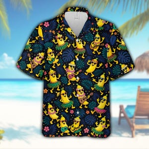 Maglietta hawaiana con banana che ride, divertente maglietta Aloha con banana danzante e motivo di foglie tropicali, ukulele e hula, ideale come regalo per le vacanze al mare e l'estate.