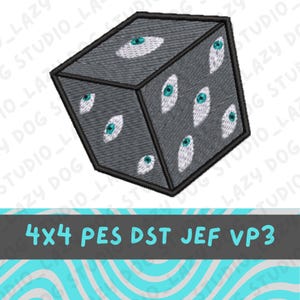 May include: A gray embroidered cube with multiple white and teal eye designs. The cube has a black border and the text "4x4 PES DST JEF VP3" in a teal and gray banner.