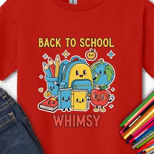 May include: A red short-sleeved t-shirt featuring a graphic print with the text BACK TO SCHOOL WHIMSY. The design includes cartoon-style illustrations of a blue backpack, a globe, books, pencils, and an apple with a face, all with smiling expressions.