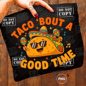 May include: Black pillow with a cartoon taco wearing sunglasses and a sombrero, holding maracas. The text reads "TACO 'BOUT A GOOD TIME" in orange. The pillow is held by a hand.