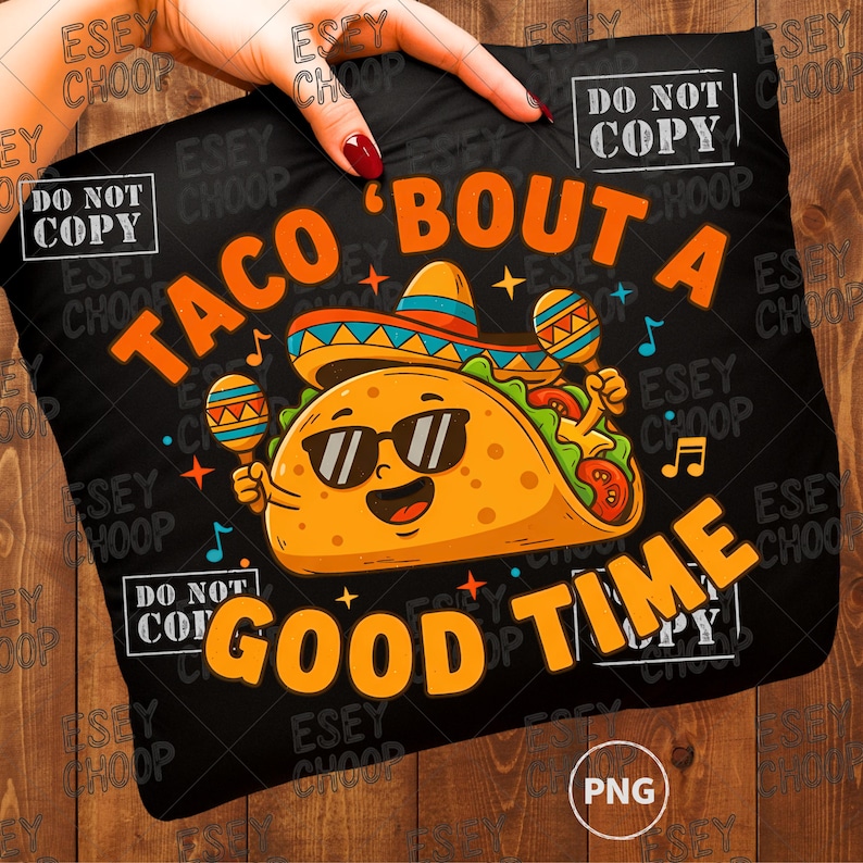 May include: Black pillow with a cartoon taco wearing sunglasses and a sombrero, holding maracas. The text reads "TACO 'BOUT A GOOD TIME" in orange. The pillow is held by a hand.