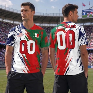 May include: A short-sleeved jersey featuring a red, white, and green brushstroke pattern. The front displays the US and Mexican flags and the number 00 in red and white. The back features the text YOUR NAME and the number 00 in red and white.