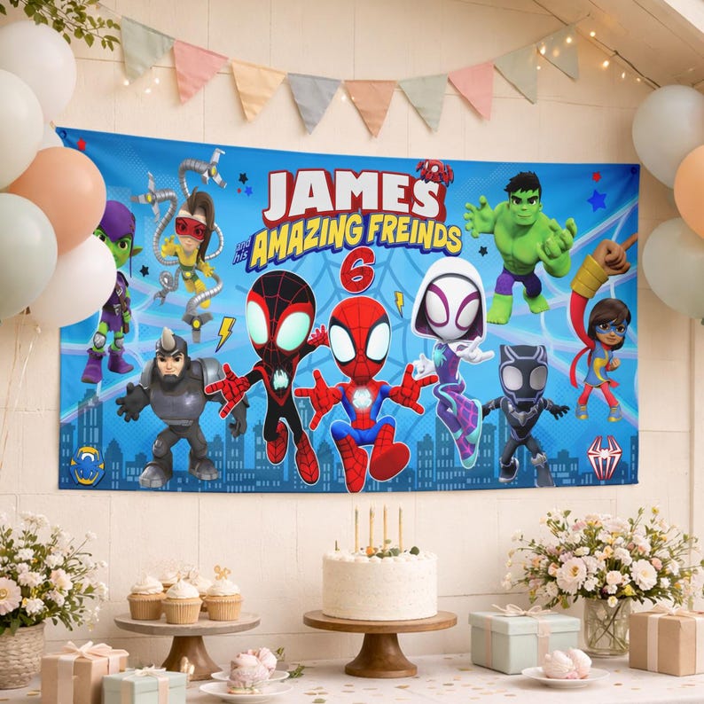 May include: A rectangular blue party banner featuring the text 'JAMES and his AMAZING FREINDS' and the number '6'. The banner displays cartoon characters including Spider-Man, Ghost-Spider, Hulk, and other figures against a city skyline background.