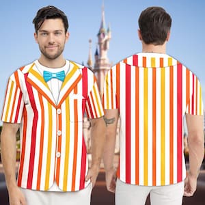 May include: A short-sleeved shirt with a colorful striped design, featuring red, orange, yellow, and white vertical stripes. The shirt has a faux blazer design with a blue bow tie and white buttons. The back of the shirt also has vertical stripes.