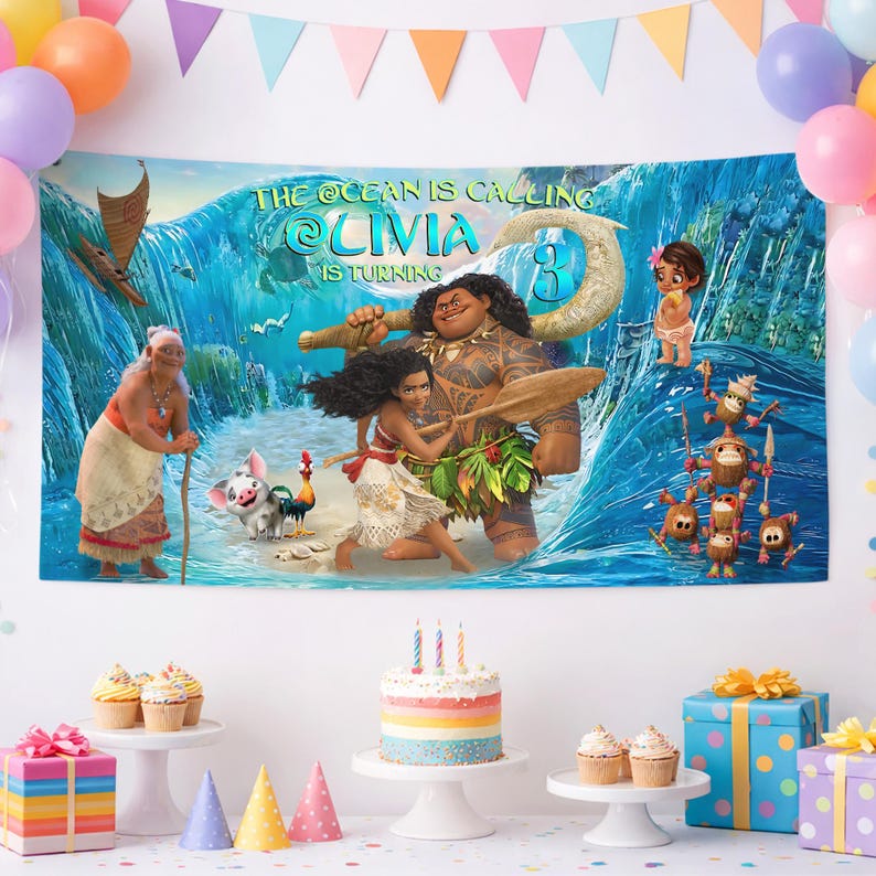 May include: A rectangular party backdrop featuring a Moana-themed graphic with characters including Moana, Maui, Pua, Heihei, and Kakamora. The text reads THE OCEAN IS CALLING LIVIA IS TURNING 3. The background displays a large blue ocean wave.