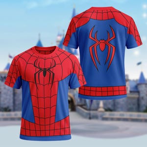 May include: A short-sleeve crew neck t-shirt featuring a red and blue color scheme with a black spider emblem on the chest and a red spider emblem on the back. The design includes a black web pattern across the red sections and a grid pattern.