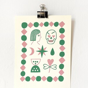 May include: A green and pink print featuring a variety of symbols including a woman's face, a skull, a crescent moon, a star, a teardrop, a heart, a clover, and a glass hourglass. The symbols are surrounded by a border of green circles and pink diamonds.