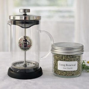 May include: A set of three ceramic nesting bowls in shades of blue, green, and white. The bowls feature a speckled glaze and a simple, modern design. The largest bowl measures approximately 6 inches in diameter.