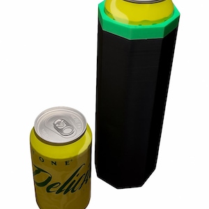May include: A yellow and green soda can next to a black and green can cooler. The can has the word "ONE" and "Delicious" printed on it. The cooler is hexagonal.