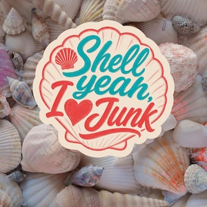 May include: A circular sticker featuring a stylized seashell shape with the text Shell yeah, I love Junk in teal and red script lettering. The sticker is layered over a background of various white, tan, and pink seashells of different shapes.