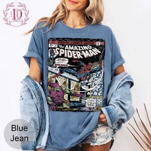 May include: A white ceramic mug with a black handle and the text "But First, Coffee" in a black, handwritten-style font. The mug is on a white surface.