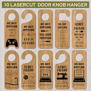 May include: Ten laser-cut wooden door knob hangers with various phrases and icons. Phrases include "Do Not Disturb" with "Gamer at Work," "Mom is Working," "True-Crime Marathon," "The Chef," "Relaxing in the Tub," "Knitting in Progress," "Shopping," "Sewing," and "Distance Learning."