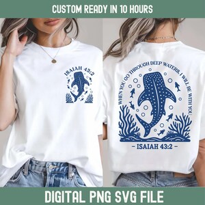 May include: White t-shirts with a blue whale shark design. The front features a whale shark illustration with the text "ISAIAH 43:2". The back displays a larger whale shark design with the text "WHEN YOU GO THROUGH DEEP WATERS, I WILL BE WITH YOU - ISAIAH 43:2".