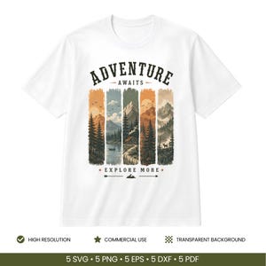 May include: A white short-sleeve t-shirt featuring a graphic print of five vertical panels depicting mountain landscapes, pine forests, a cabin, and a lake. The text ADVENTURE AWAITS is printed above the panels, and EXPLORE MORE is printed below.