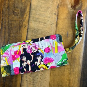 SailormoonFabric Wallet with zipper compartment, 6 card slots, and 1 hidden pockets. 7 1/2" long x 4" wide. Padded. Washable and Lightweight