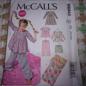 May include: Sewing pattern for a child's sleepwear set, including a top, pants, and a sleeping bag. The pattern is from McCall's and is labeled "Easy".