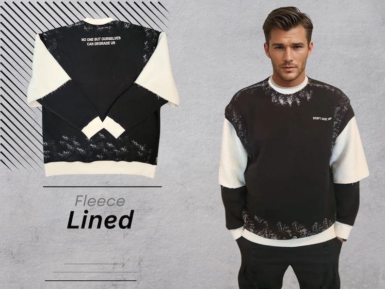 May include: Black and white fleece-lined sweatshirt with a white and black splatter design. The sweatshirt has the text "No one but ourselves can degrade us" on the front and "Don't give up" on the back.