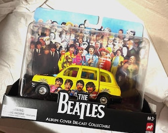 The Beatles’Sgt Peppers’ Corgi boxed taxi 2008 mint condition