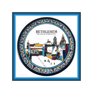May include: A decorative plate featuring a colorful illustration of Bethlehem's Church of the Nativity. The plate has a blue border and the text "BETHLEHEM THE CHURCH OF THE NATIVITY". The plate is framed in a square blue frame.