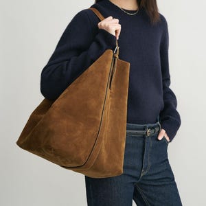 brown suede tote bag
large leather tote bag women
handmade suede shoulder bag
genuine leather handbag
oversized suede purse
adjustable strap leather tote
brown suede handbag
women’s work tote leather
cowhide suede shoulder bag
handcrafted suede leather tote
luxury suede leather purse
everyday suede tote bag
brown leather carryall bag
eco-friendly leather handbag
boho suede leather tote
casual brown suede bag
travel leather tote bag women
minimalist suede tote
autumn suede leather bag
gift for