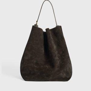 large suede tote for travel
stylish suede leather carryall bag
women’s brown leather tote purse
elegant suede handbag with strap
boho style suede leather tote
chic brown suede leather shopper
adjustable strap suede leather purse
durable leather tote for everyday use
minimalist design suede leather bag
spacious suede tote for women
cowhide suede leather shoulder tote
soft suede leather handbag large
eco conscious leather tote bag
vintage inspired suede leather tote
high end suede leather work bag