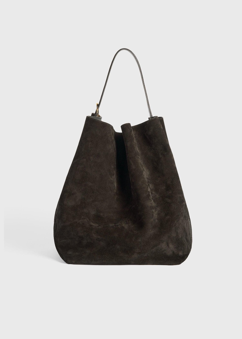 large suede tote for travel
stylish suede leather carryall bag
women’s brown leather tote purse
elegant suede handbag with strap
boho style suede leather tote
chic brown suede leather shopper
adjustable strap suede leather purse
durable leather tote for everyday use
minimalist design suede leather bag
spacious suede tote for women
cowhide suede leather shoulder tote
soft suede leather handbag large
eco conscious leather tote bag
vintage inspired suede leather tote
high end suede leather work bag