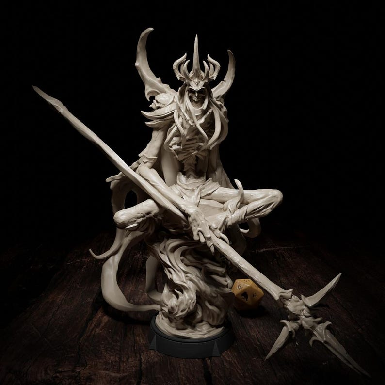 May include: An off-white fantasy figurine depicting a skeletal figure with a horned crown, seated and holding a spear. The figurine sits on a black base, with a wooden surface in the background. A yellow die is near the spear.