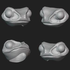 May include: Four views of a gray frog head sculpture. The frog has large, round eyes and a wide mouth. The sculpture is smooth and appears to be made of clay or a similar material. The background is a solid dark gray.