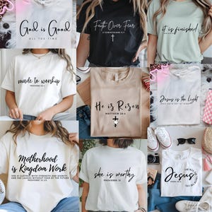 May include: Collection of t-shirts with inspirational quotes in black script. Shirts are various colors, including white, black, and beige. Quotes include "God is Good," "Faith Over Fear," "He is Risen," and "Jesus is the Light."