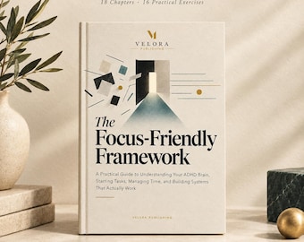 May include: A hardcover book titled The Focus-Friendly Framework with a cream-colored cover. The front features the text ADHD GUIDE + WORKBOOK, 18 Chapters, 16 Practical Exercises, and the Velora Publishing logo. The cover art shows a doorway graphic.